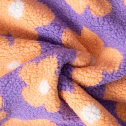 Tissu Sherpa Elya  Fleurs Oranges sur fond Violet