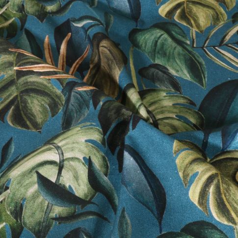 Tissu Toile de Coton Canvas Feuilles tropicales sur fond Bleu canard