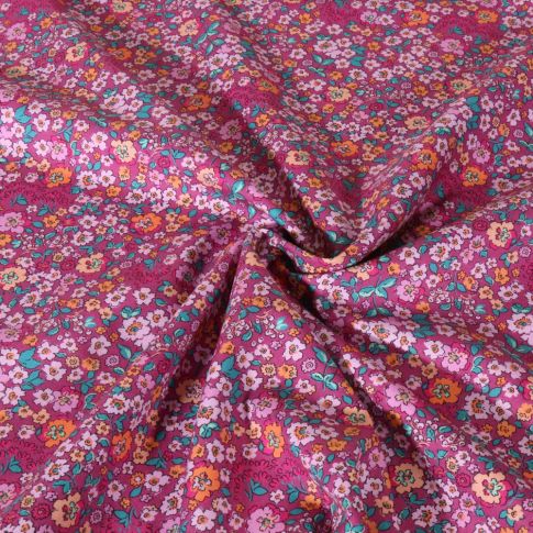 Tissu Popeline de Coton digital Poppy Fleurs roses et pêche sur fond Framboise