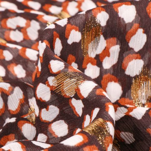 Tissu Mousseline Taches blanches orange et dorés sur fond Marron