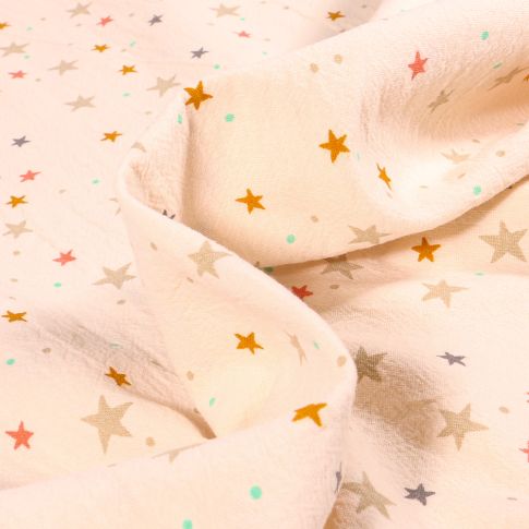 Tissu Coton lavé Etoiles multicolores sur fond Ecru
