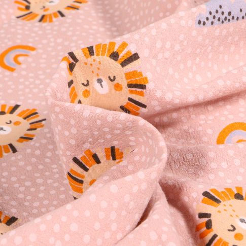 Tissu Coton Lavé Têtes de lion soleil sur fond Rose