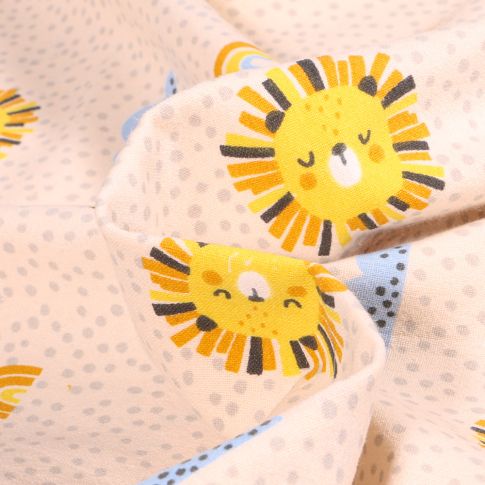 Tissu Coton Lavé Têtes de lion soleil sur fond Ecru