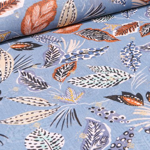 Tissu Mousseline Feuilles ethniques sur fond Bleu ciel