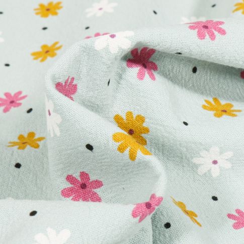 Tissu Coton lavé Pâquerettes colorés sur fond Vert menthe clair