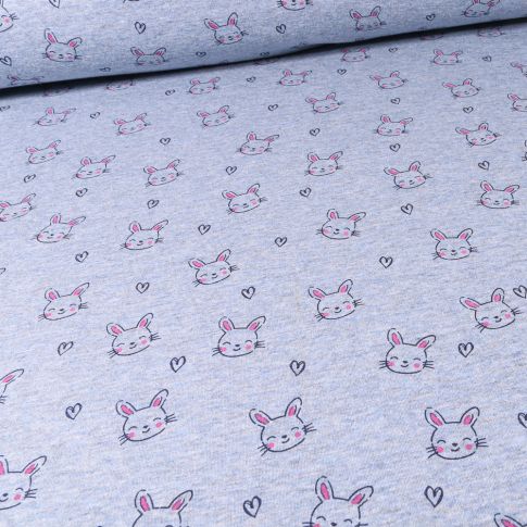 Tissu Sweat envers minky Têtes de lapins et coeurs sur fond Bleu chiné