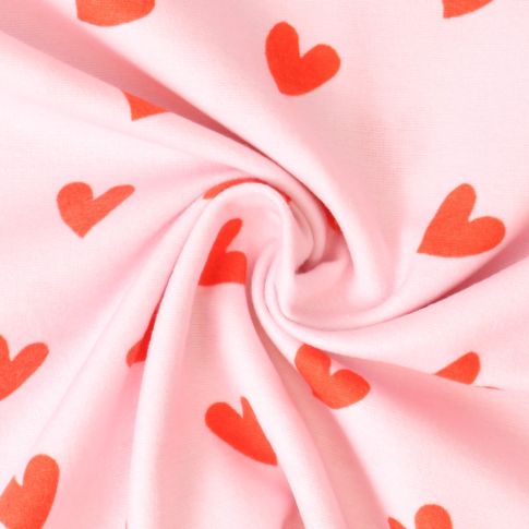 Tissu Flanelle de Coton  Caline cœurs Rouges sur fond Rose