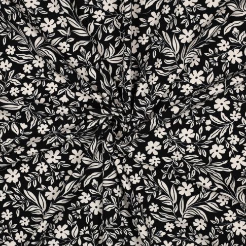 Tissu Jersey Coton imprimé Petites Fleurs Blanches sur fond Noir