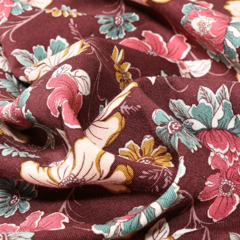 Tissu Viscose Twill extensible Pivia sur fond Bordeaux