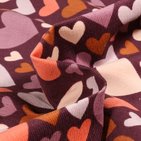 Tissu Velours milleraies Coeurs colorés sur fond Bordeaux
