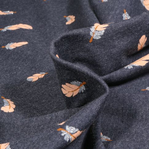 Tissu Jersey Coton Plumes pailletées sur fond Bleu chiné