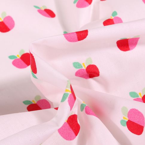 Tissu Coton enduit Pommes bicolores sur fond Blanc