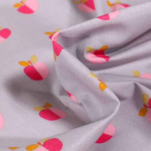 Tissu Coton enduit Pommes bicolores sur fond Gris clair
