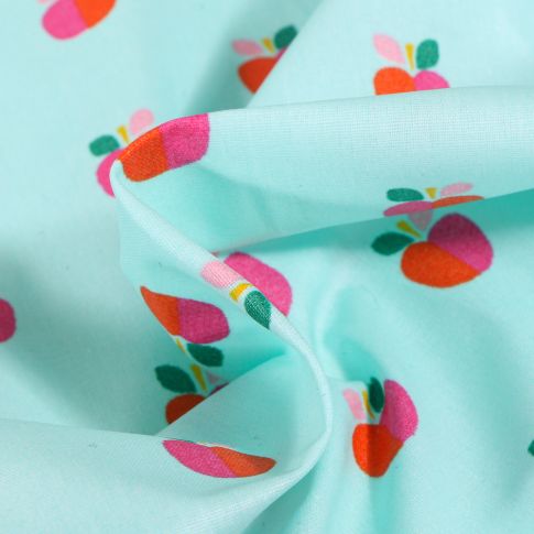 Tissu Coton enduit Pommes bicolores sur fond Bleu