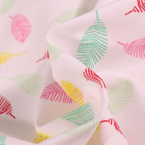 Tissu Coton enduit Feuilles multicolores sur fond Blanc
