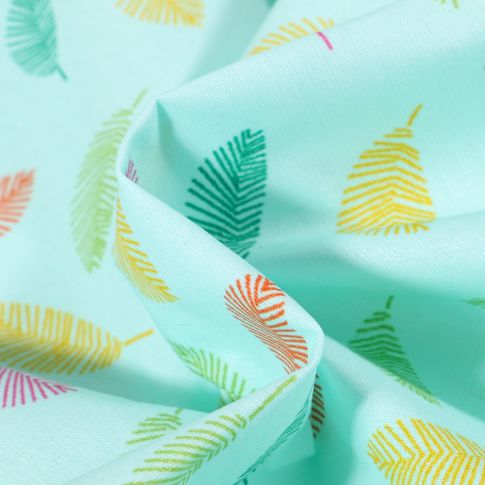 Tissu Coton enduit Feuilles multicolores sur fond Bleu turquoise
