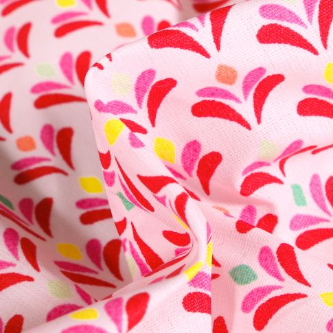 Tissu Coton enduit Pétales multicolores sur fond Rose
