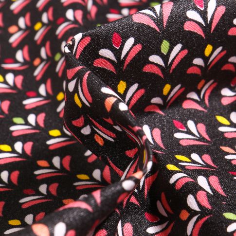 Tissu Coton enduit Pétales multicolores sur fond Noir