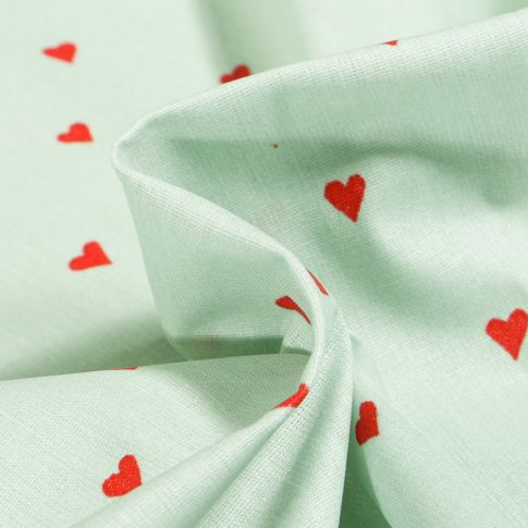 Tissu Coton enduit Petits cœurs rouges sur fond Vert menthe