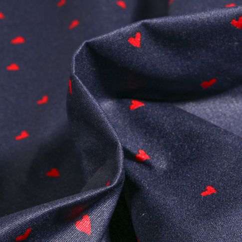 Tissu Coton enduit Petits cœurs rouges sur fond Bleu marine