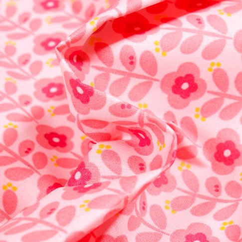 Tissu Coton enduit Fleurs seventies rose sur fond Rose pâle