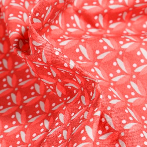 Tissu Coton enduit Pétales et pois sur fond Rouge