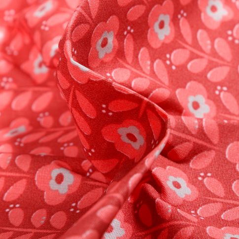 Tissu Coton enduit Fleurs seventies sur fond Rouge