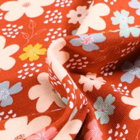 Tissu Jersey Coton Bio Pensées colorées sur fond Rouille