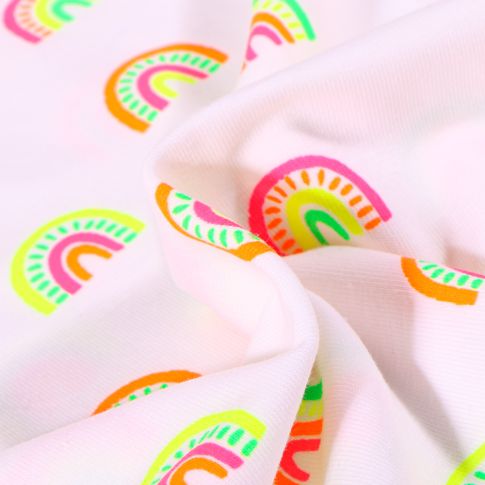 Tissu Jersey Coton Arc en ciel fluo sur fond Blanc