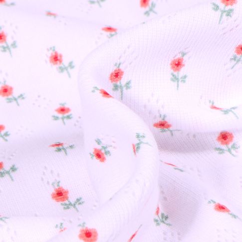 Tissu Jersey ajouré Petites fleurs sur fond Blanc