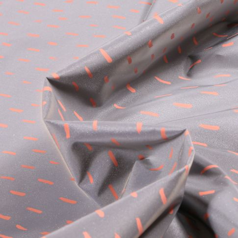 Tissu Imperméable réfléchissant Pointillés orange sur fond Gris