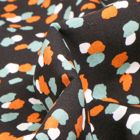 Tissu Viscose Tâches blanches menthe et orange sur fond Noir