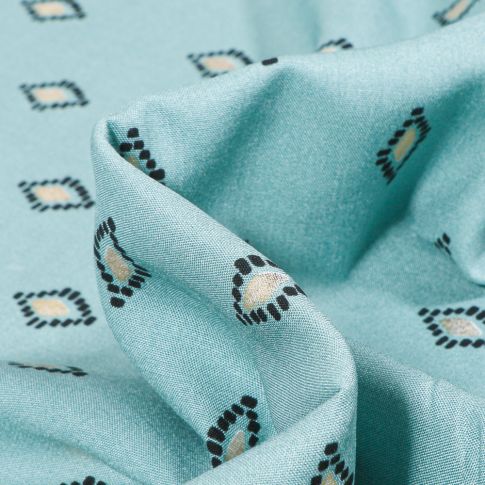 Tissu Viscose Losanges ethniques dorés sur fond Bleu ciel