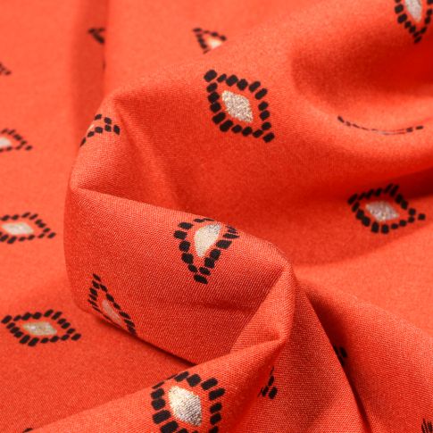 Tissu Viscose Losanges ethniques dorés sur fond Orange
