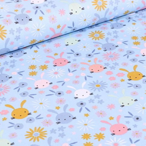 Tissu Coton imprimé Têtes lapinou sur fond Bleu ciel
