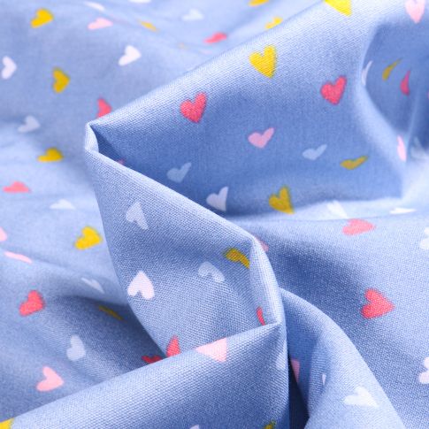 Tissu Coton imprimé Petits cœurs colorés sur fond Bleu ciel