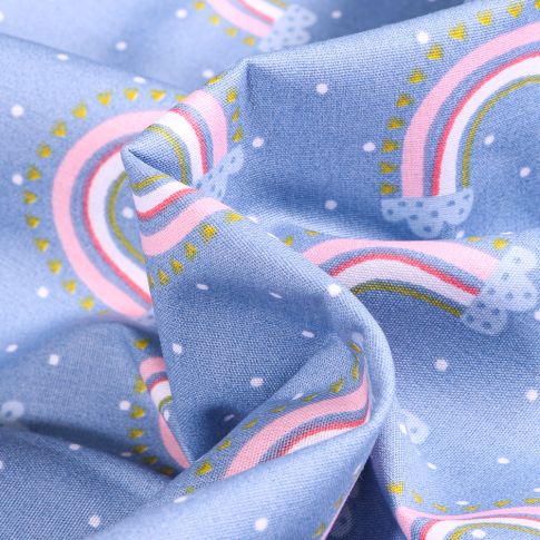 Tissu Coton imprimé Arc en ciel pastel sur fond Bleu ciel