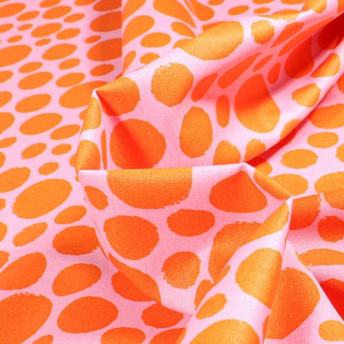 Tissu Coton imprimé Petits et moyens pois orange sur fond Rose