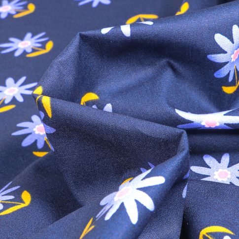 Tissu Coton imprimé Flo sur fond Bleu