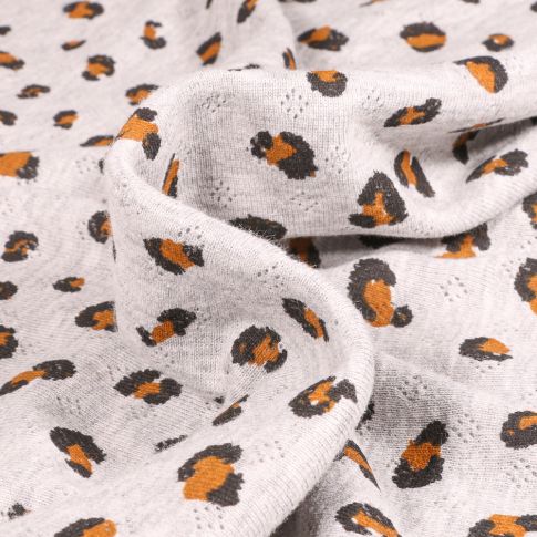 Tissu jersey ajouré LéoLéo sur fond Gris clair