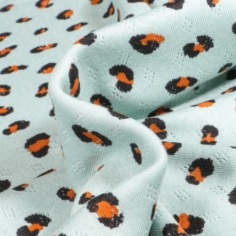 Tissu jersey ajouré LéoLéo sur fond Vert menthe