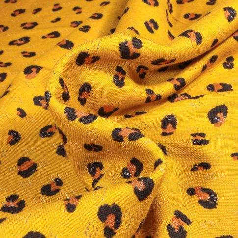 Tissu jersey ajouré LéoLéo sur fond Jaune