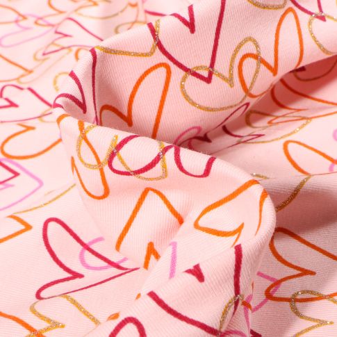 Tissu Jersey coton envers molletonné Coeurs multicolores sur fond Rose