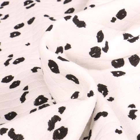 Tissu Sweat matelassé Tacheté Léo sur fond Blanc