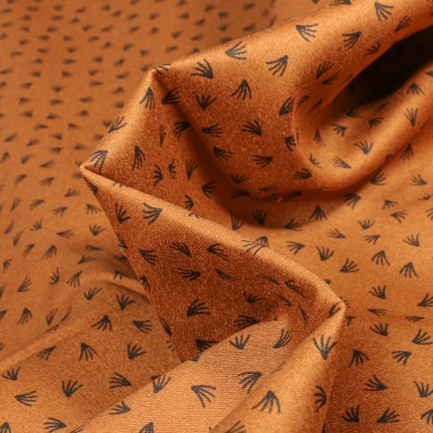 Tissu Coton satiné extensible Eclats de pissenlits sur fond Camel