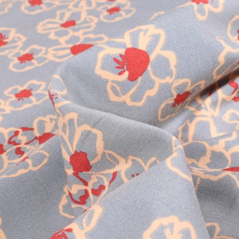 Tissu Viscose extensible  Fleurs stylisées sur fond Bleu ciel