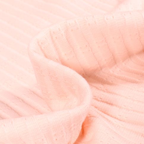 Tissu Maille Côtelé ajouré sur fond Rose nude