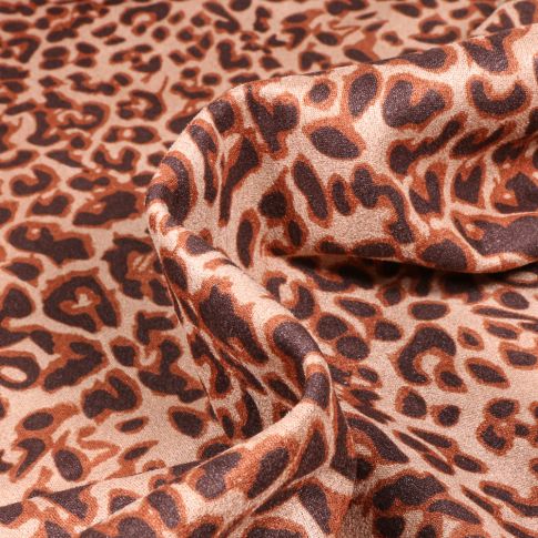 Tissu Suédine Elasthanne aspect Daim Léopard marron sur fond Beige