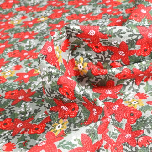 Tissu Coton imprimé Fleurs de noël sur fond Vert d'eau