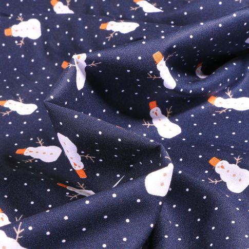 Tissu Coton imprimé Bonhomme de neige sur fond Bleu marine
